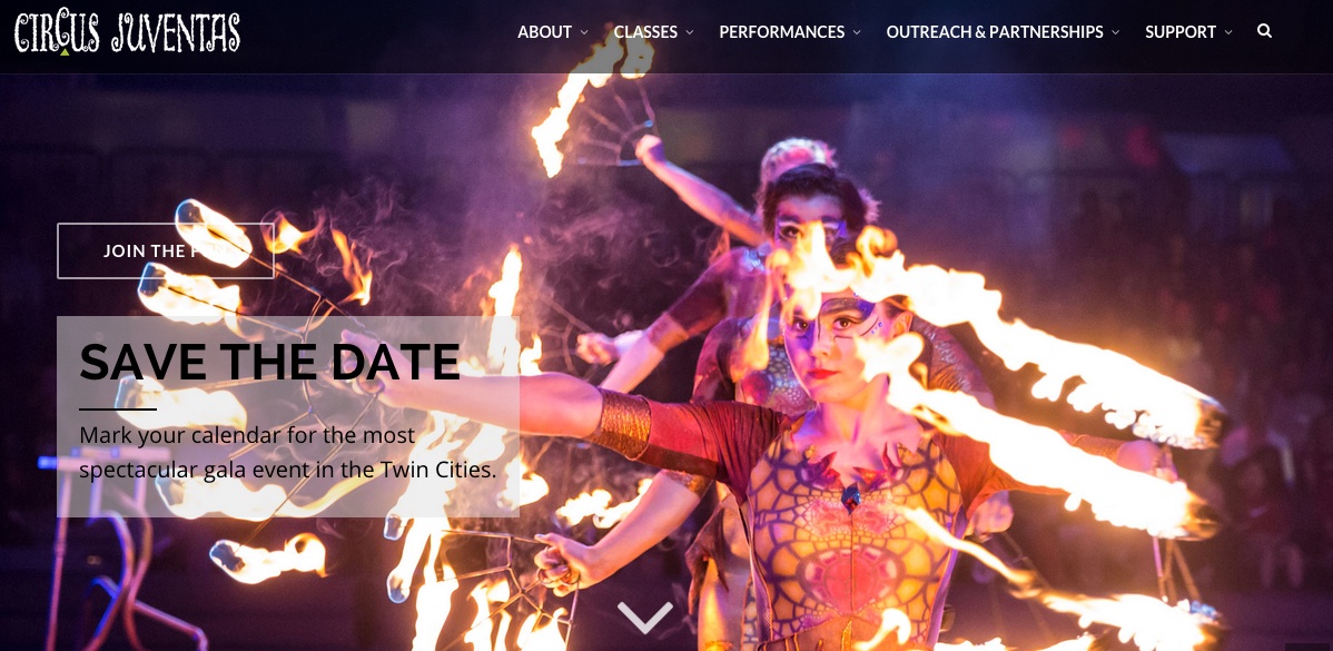 Homepage image from Circus Juventas circa 2015 picturing costumed performers with torches